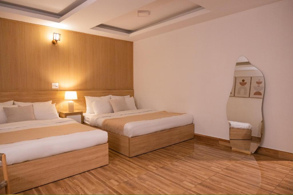 Postel nebo postele na pokoji v ubytování Phương Trinh Hotel