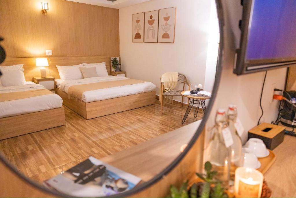 Postel nebo postele na pokoji v ubytování Phương Trinh Hotel
