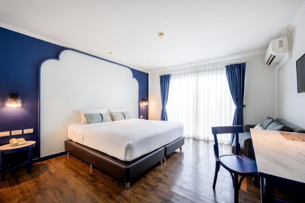 Postel nebo postele na pokoji v ubytování Bhukitta Boutique Hotel Phuket Town