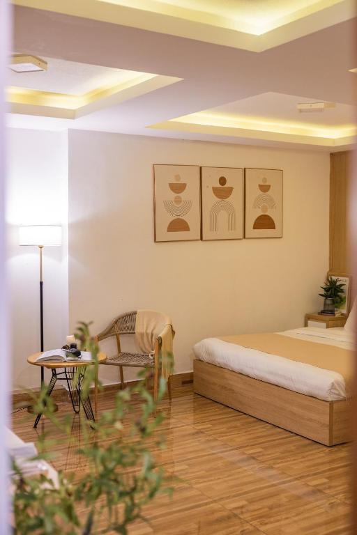 Postel nebo postele na pokoji v ubytování Phương Trinh Hotel