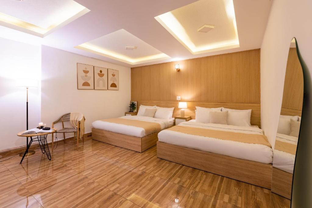 Postel nebo postele na pokoji v ubytování Phương Trinh Hotel
