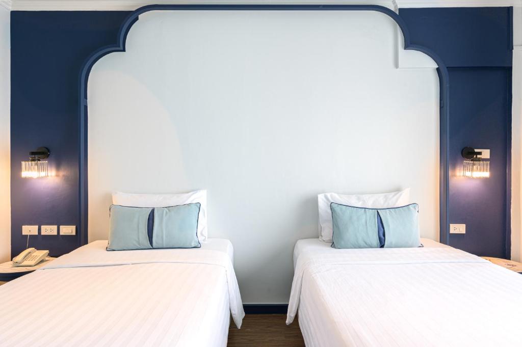 Postel nebo postele na pokoji v ubytování Bhukitta Boutique Hotel Phuket Town