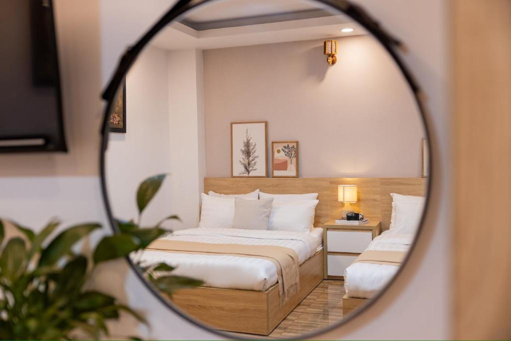 Postel nebo postele na pokoji v ubytování Phương Trinh Hotel