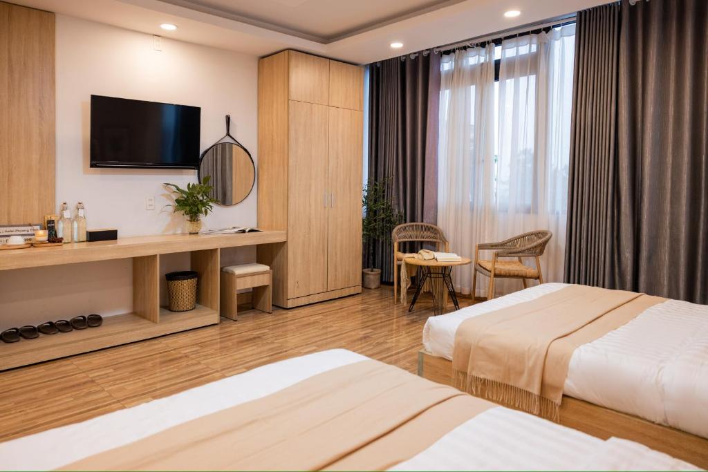 Postel nebo postele na pokoji v ubytování Phương Trinh Hotel