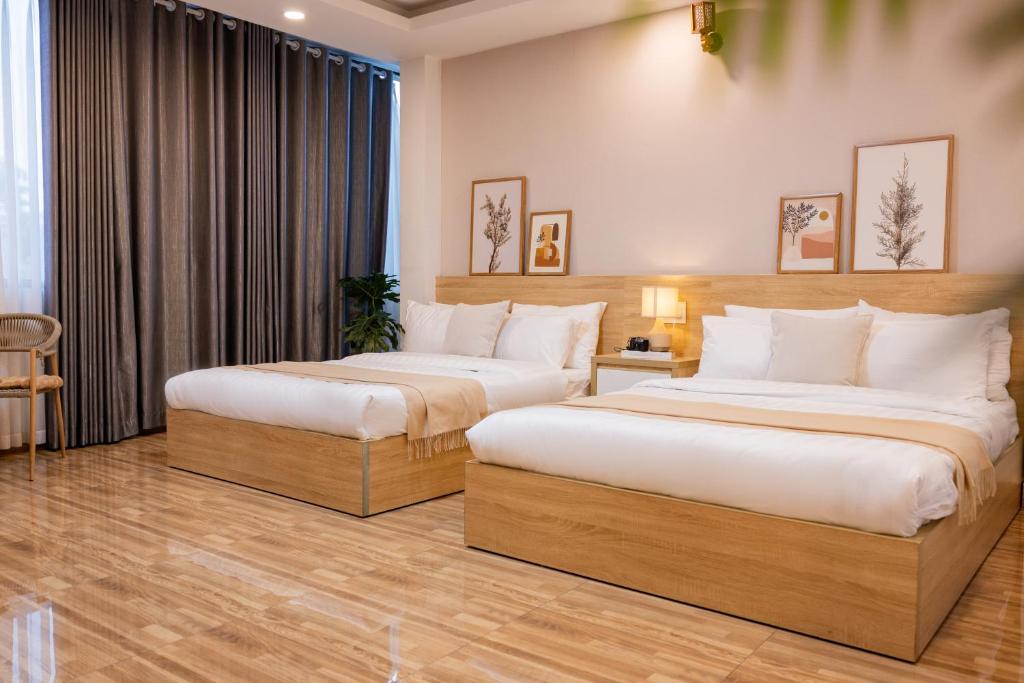 Postel nebo postele na pokoji v ubytování Phương Trinh Hotel