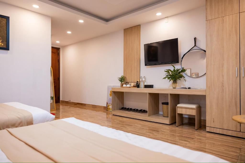 Postel nebo postele na pokoji v ubytování Phương Trinh Hotel