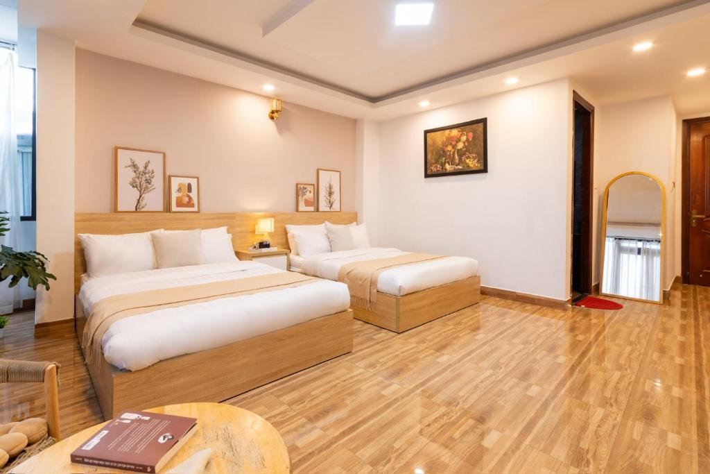 Postel nebo postele na pokoji v ubytování Phương Trinh Hotel