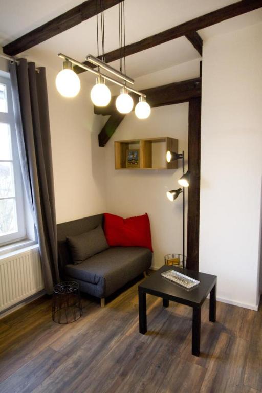 a living room with a couch and a table at NEU! FeWo Märchenstube in Alsfeld
