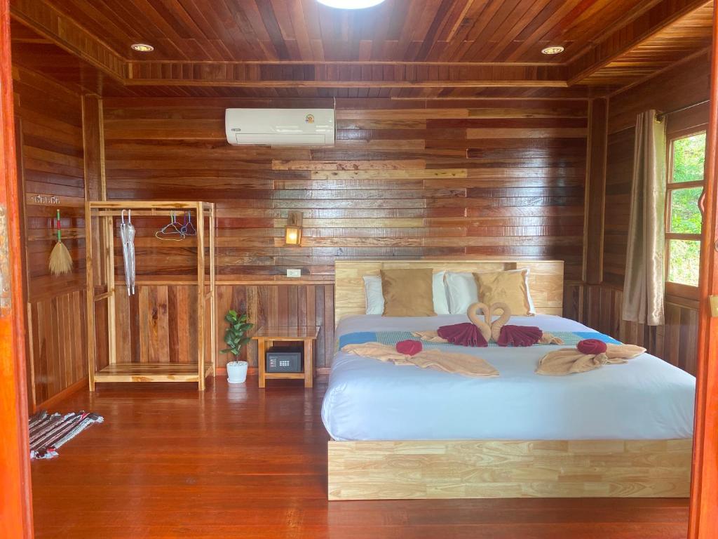 Postel nebo postele na pokoji v ubytování Cha Cha Bungalow