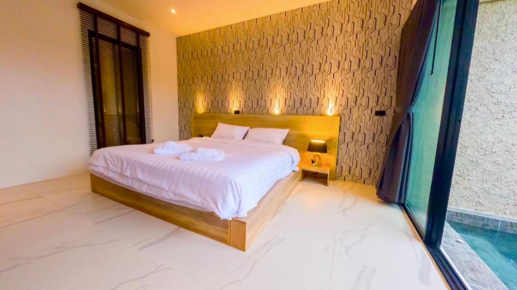 Postel nebo postele na pokoji v ubytování R resident resort