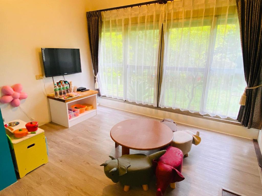 TV a/nebo společenská místnost v ubytování Xiangyang Tianyuan