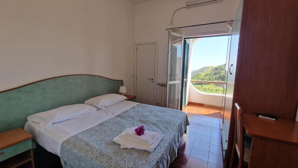 Postel nebo postele na pokoji v ubytování Hotel Bellavista