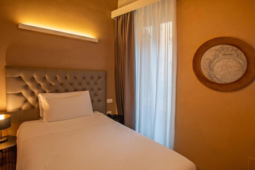 Postel nebo postele na pokoji v ubytování Hotel Elite