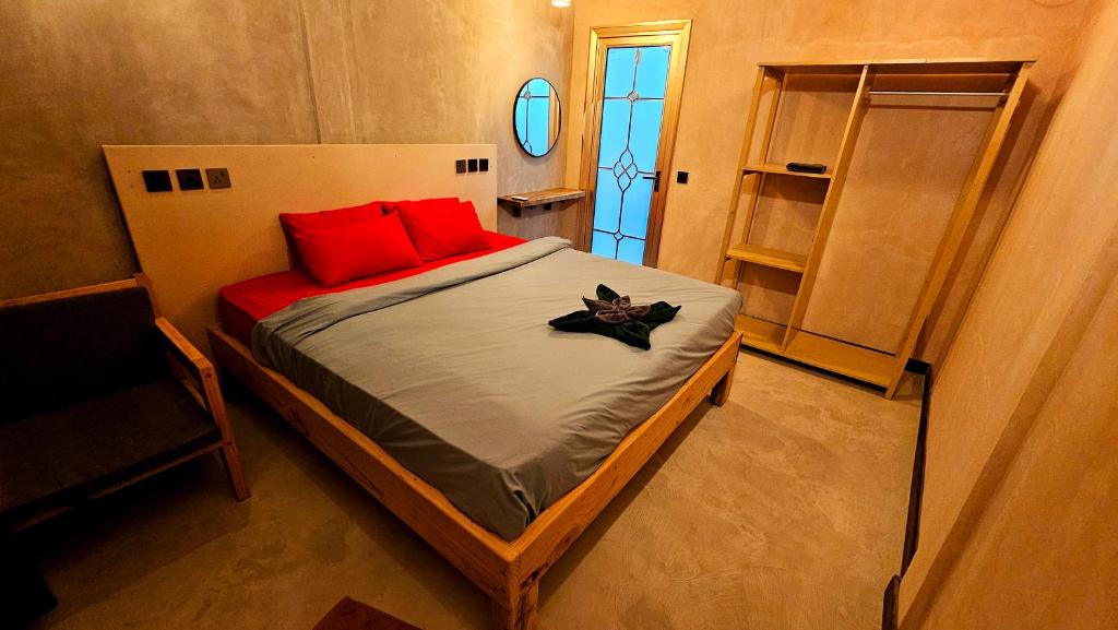 Postel nebo postele na pokoji v ubytování Dhaankolhu Rasdhoo