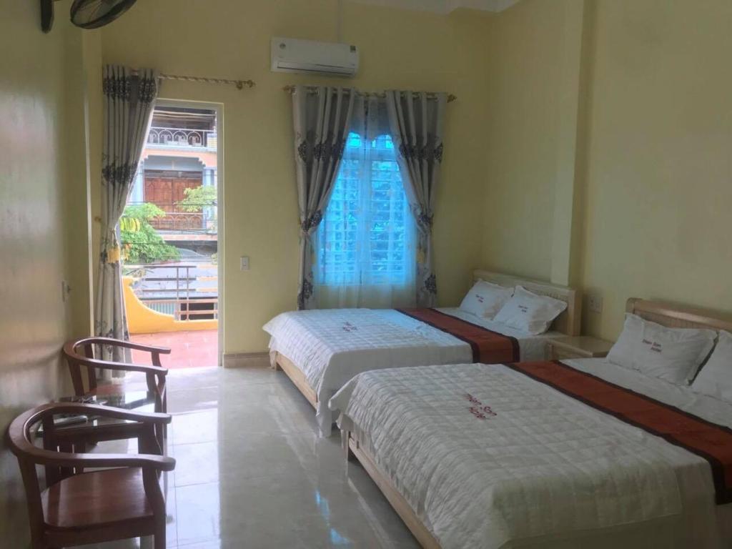 Postel nebo postele na pokoji v ubytování Thien Son Guesthouse