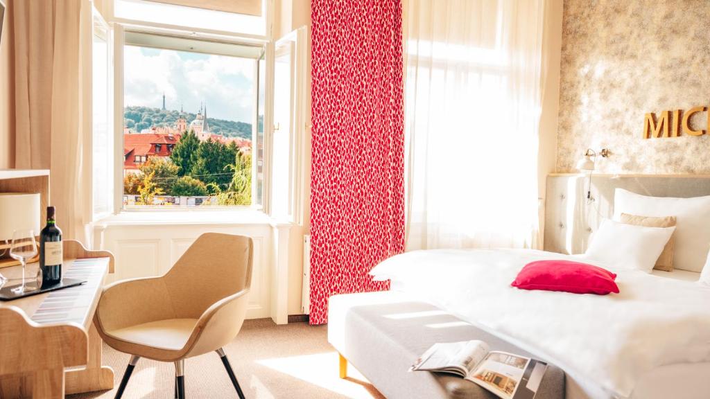 Postel nebo postele na pokoji v ubytování Boutique Hotel Klarov