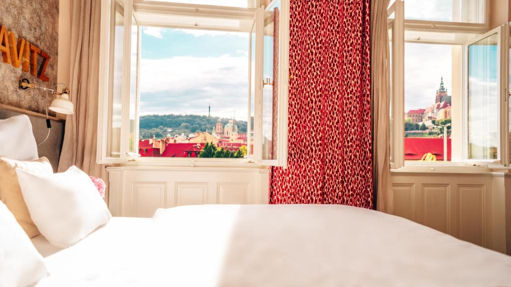 Postel nebo postele na pokoji v ubytování Boutique Hotel Klarov