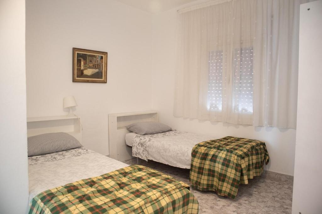 Postel nebo postele na pokoji v ubytování brisa medeterraneo 7