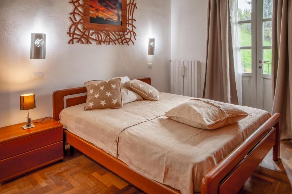 Postel nebo postele na pokoji v ubytování Casa nelle Langhe A
