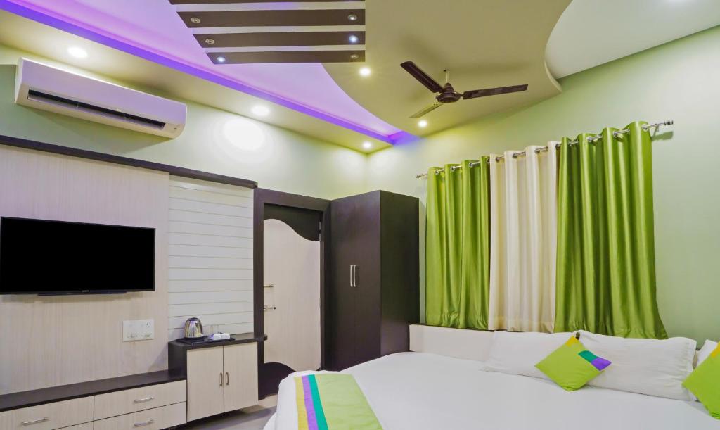TV a/nebo společenská místnost v ubytování Hotel Raj Garden