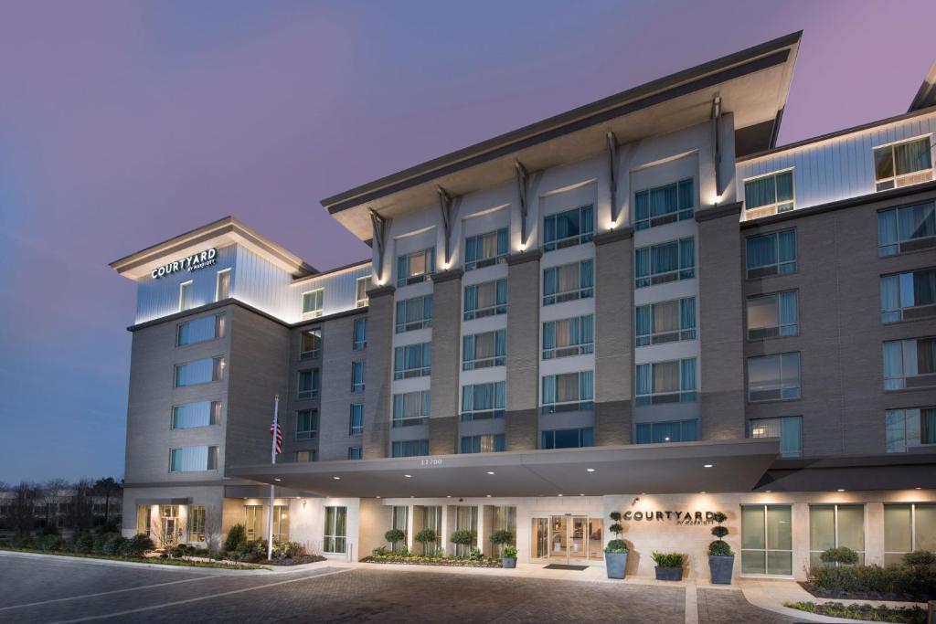 a rendering of the front of a hotel at Courtyard by Marriott Atlanta Alpharetta/Avalon Area in Alpharetta