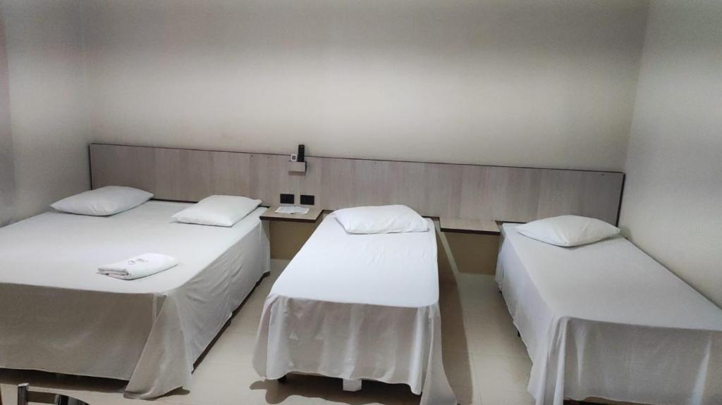 Postel nebo postele na pokoji v ubytování Hotel Globo