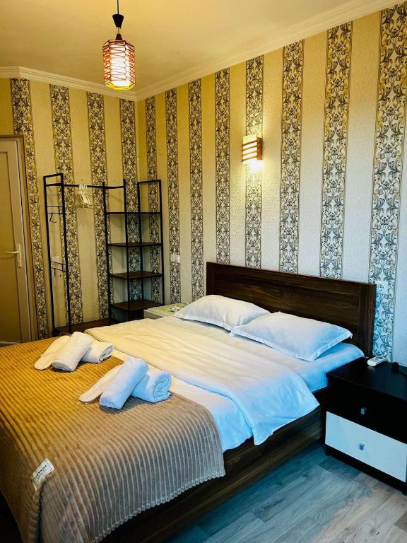 Postel nebo postele na pokoji v ubytování Hotel Marioni