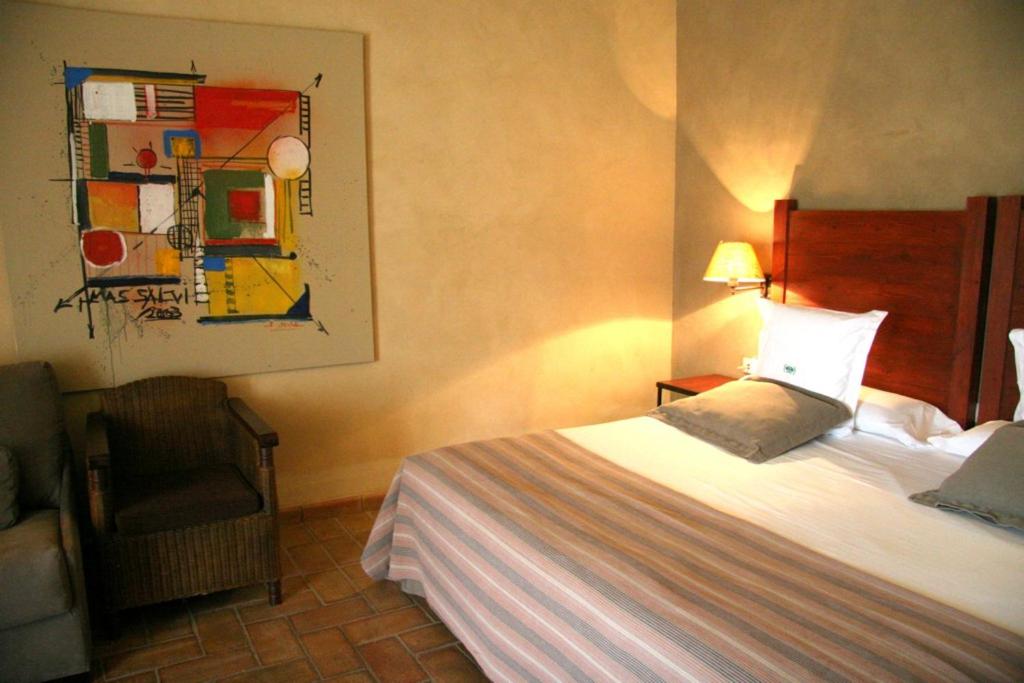 Postel nebo postele na pokoji v ubytování Mas Salvi Country Boutique Hotel
