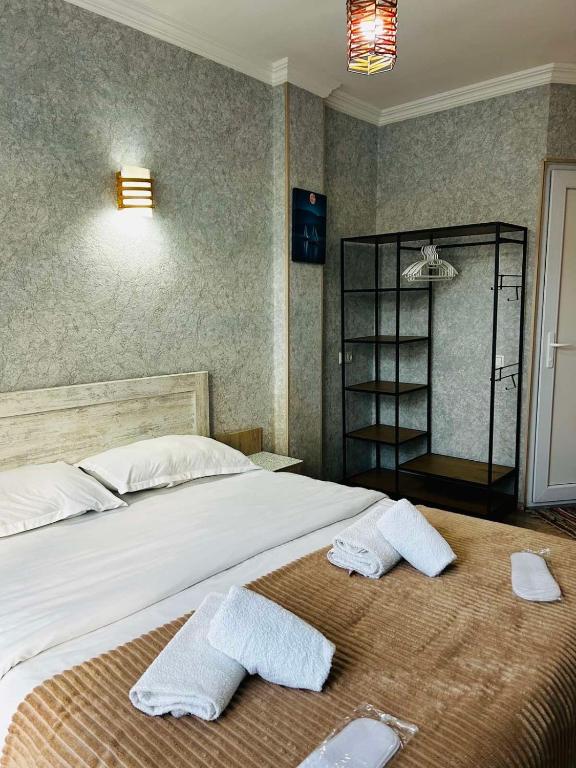 Postel nebo postele na pokoji v ubytování Hotel Marioni