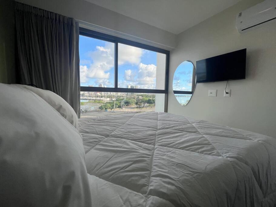 Ένα ή περισσότερα κρεβάτια σε δωμάτιο στο Flat de Luxo no Parque do Cais