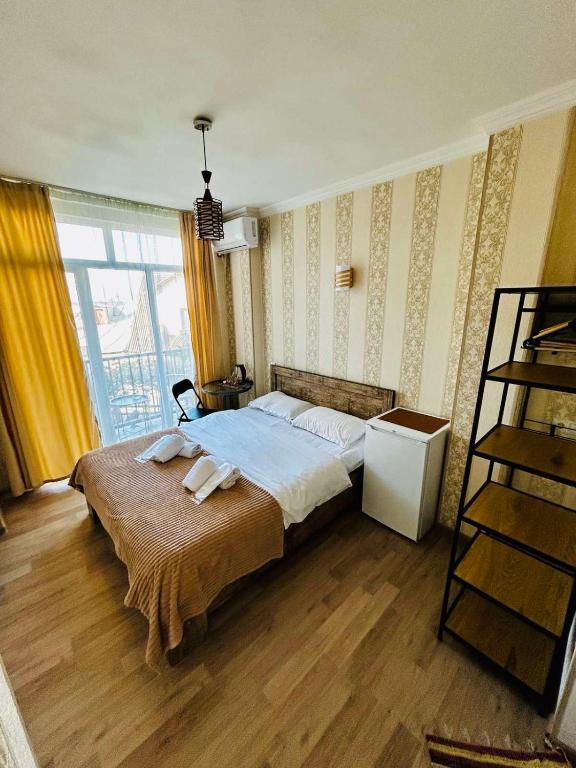Postel nebo postele na pokoji v ubytování Hotel Marioni