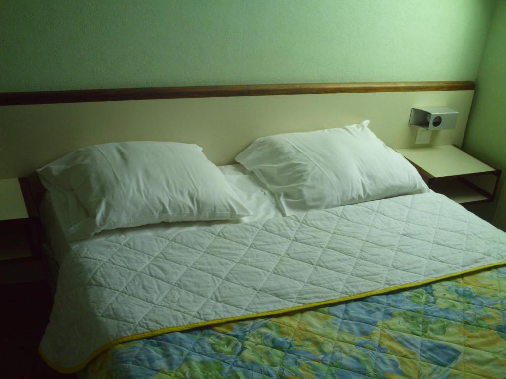 Postel nebo postele na pokoji v ubytování Hôtel l'Eden