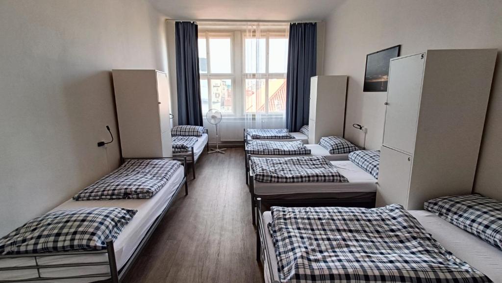 Postel nebo postele na pokoji v ubytování A Plus Hostel - Centrum