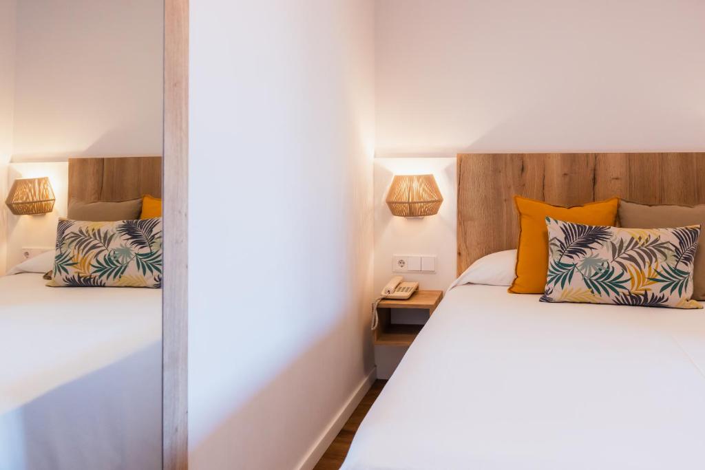 Postel nebo postele na pokoji v ubytování Hotel Restaurant Bon Retorn