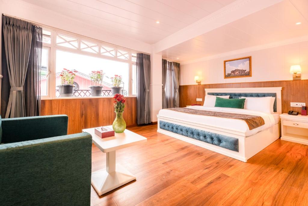 Postel nebo postele na pokoji v ubytování Summit Mall Stone Hotel