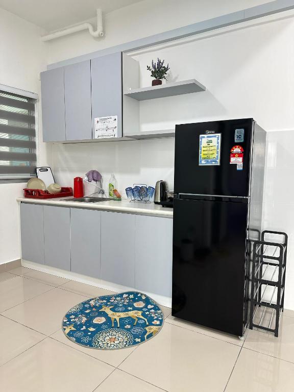 Kuchyň nebo kuchyňský kout v ubytování Seremban Pool View 5-6 pax Suite
