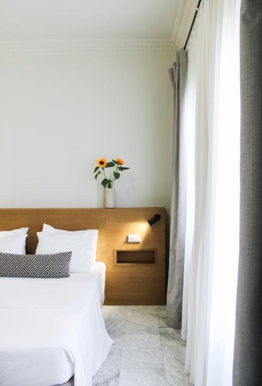 Postel nebo postele na pokoji v ubytování OIKO MINI SUITES