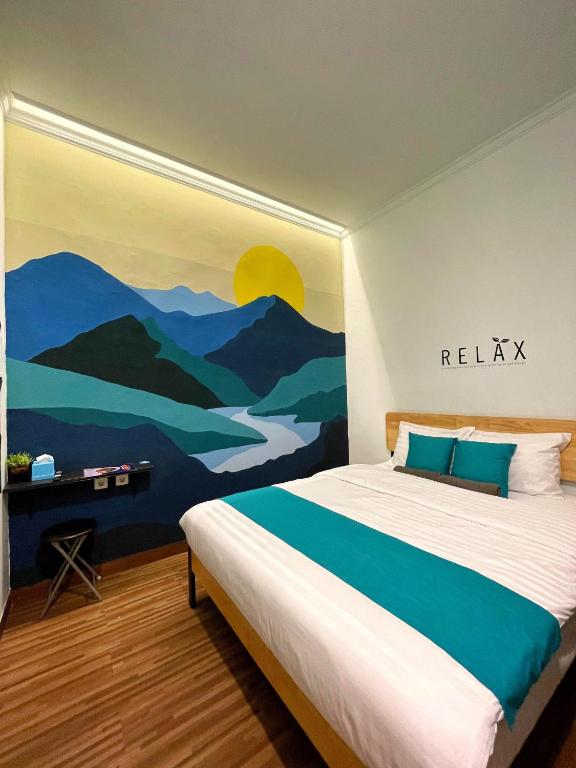 Postel nebo postele na pokoji v ubytování ROOM Ijen Hostel