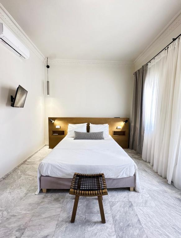 Postel nebo postele na pokoji v ubytování OIKO MINI SUITES
