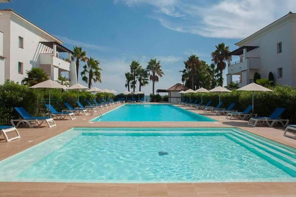 Πισίνα στο ή κοντά στο Appartement dans résidence avec piscine et plage privées