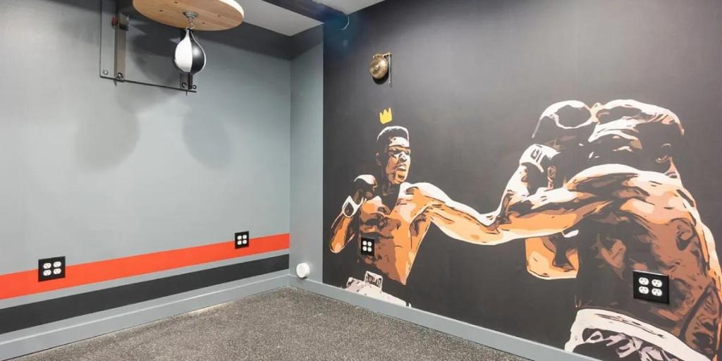 a room with a large painting on the wall at Landing at Perry Street Lofts - 2 Bedrooms in Petersburg in Petersburg