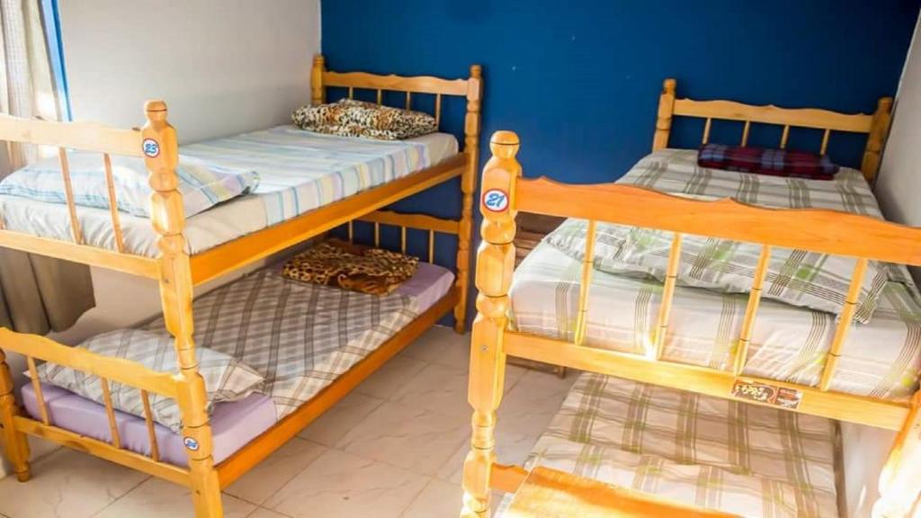 Rúm í herbergi á Scott Hostel Ilha Grande