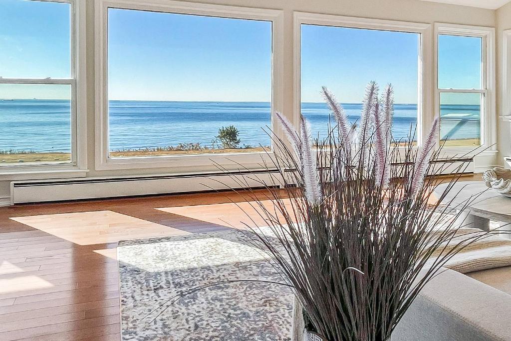 a living room with a view of the ocean at Akasa in Stratford