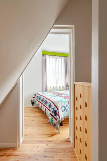 Postel nebo postele na pokoji v ubytování Sakura House