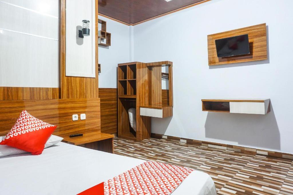 Ένα ή περισσότερα κρεβάτια σε δωμάτιο στο Hotel O Penginapan Dafandra Beach Near Pantai Tanjung Bira