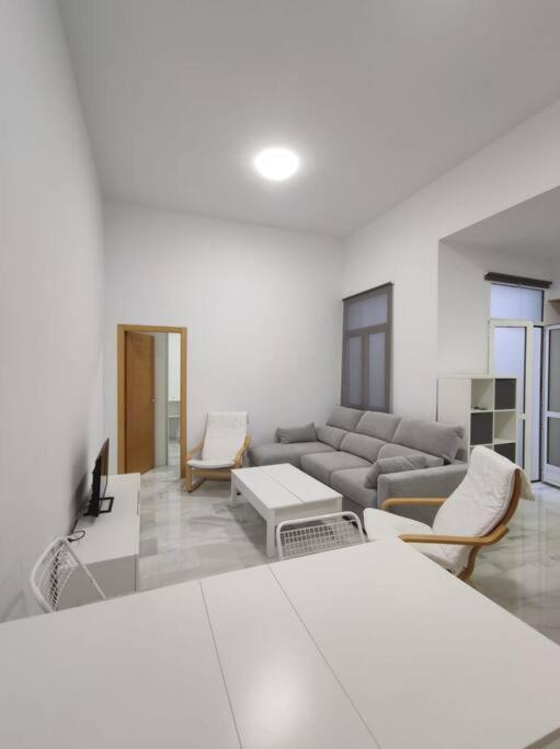 a living room with a couch and a table at El Rincón de Don Gonzalo in Puente Genil
