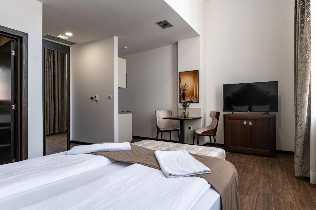 Postel nebo postele na pokoji v ubytování Apartmani Astral