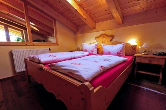 Postel nebo postele na pokoji v ubytování Winklmoos Sonnenalm
