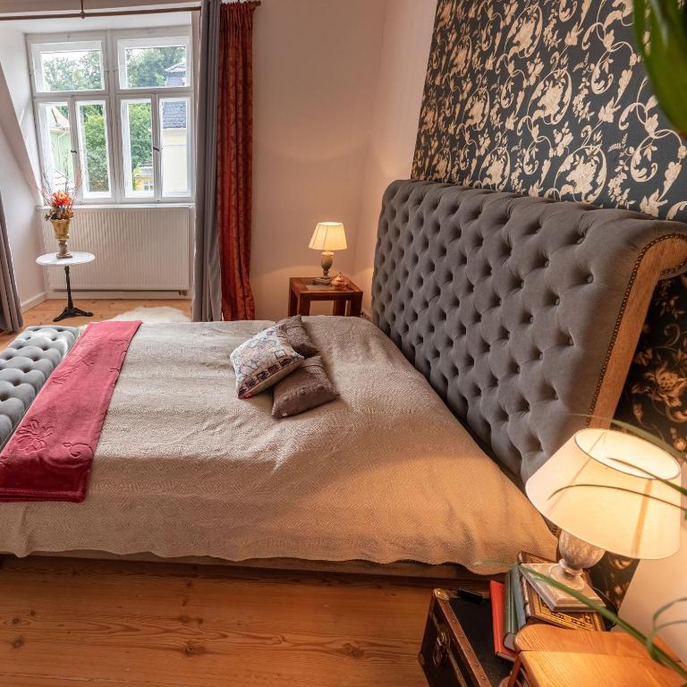 Postel nebo postele na pokoji v ubytování Ferienwohnung Anno1898 Zittau