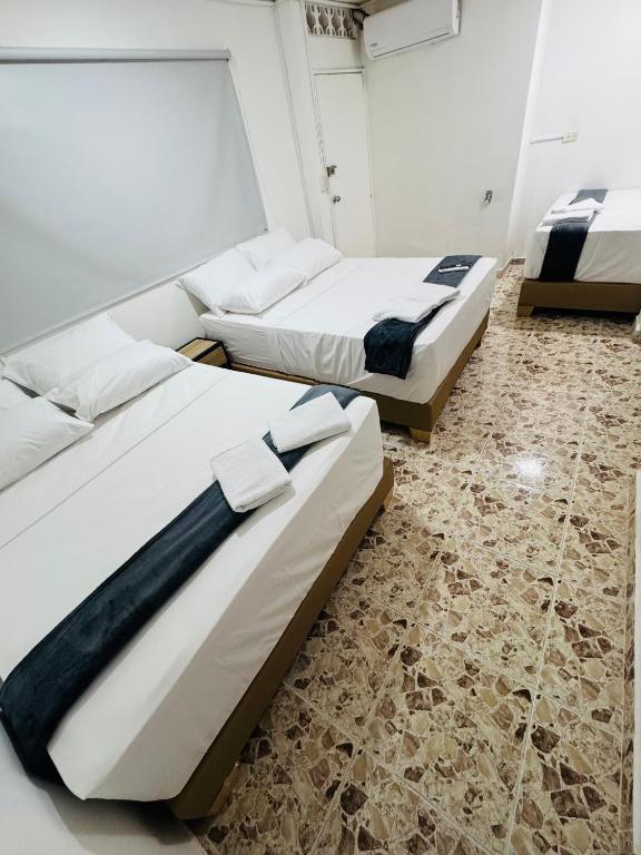 Postel nebo postele na pokoji v ubytování Hotel Estadio 80
